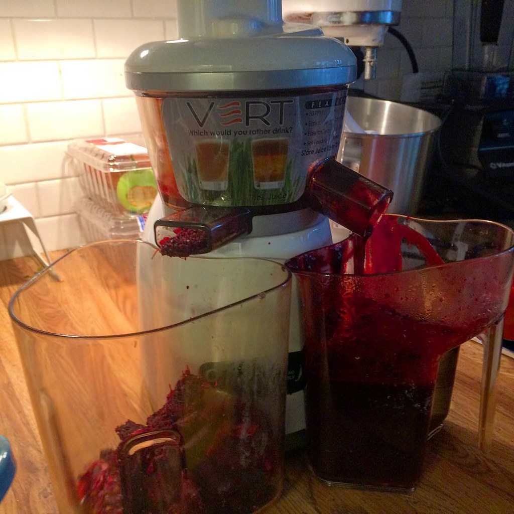 An electric juicer on a kitchen counter
